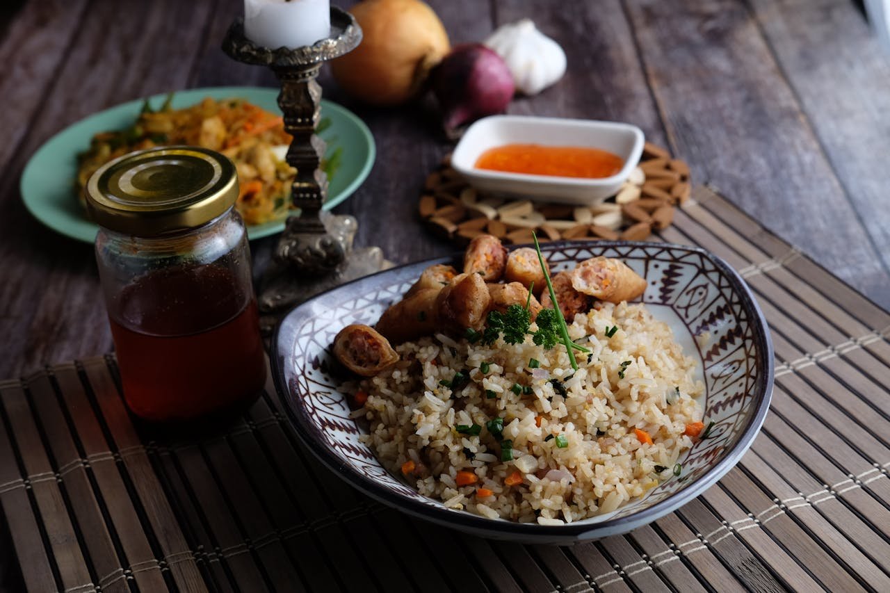 Tasty bowl of Asian stir-fried rice with vibrant ingredients, perfect for food photography.